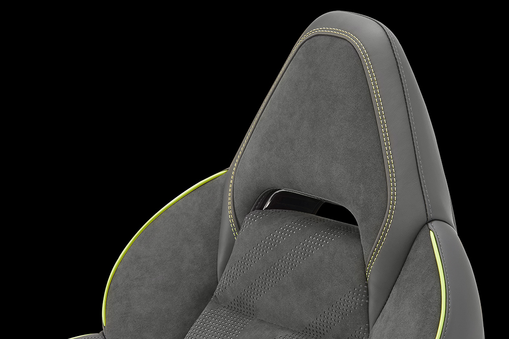 Grey vehicle bucket seat with green trim