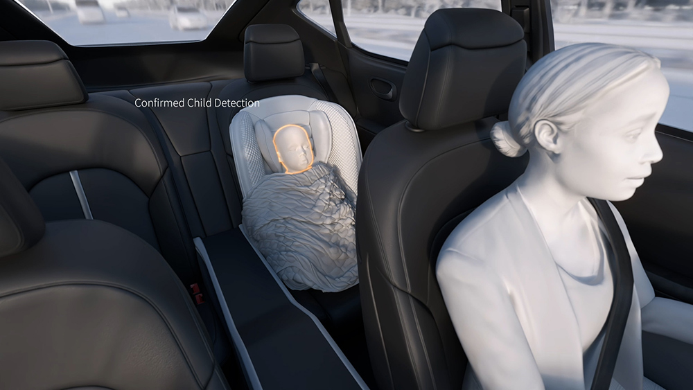 Animation of person driving a vehicle and a baby is detected in the back seat using occupant monitoring technology
