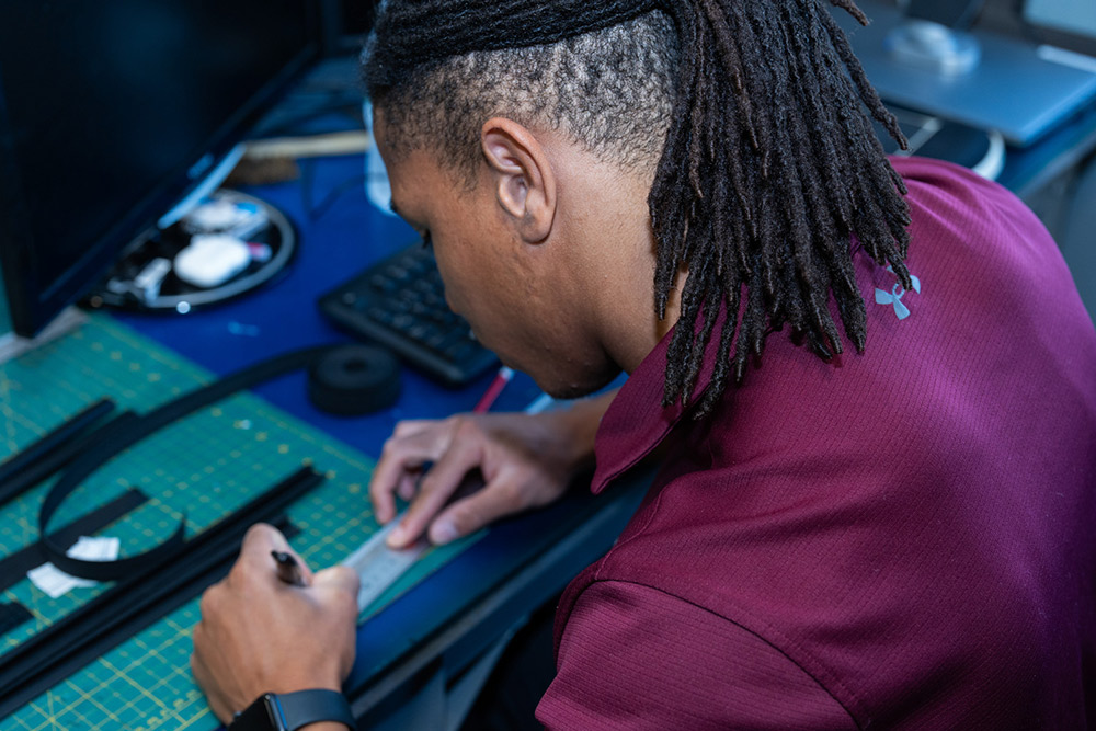 Person working at a desk on designs