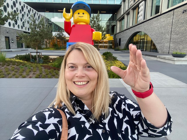 Svetlana Rajacic standing in front of a large sized LEGO® figure